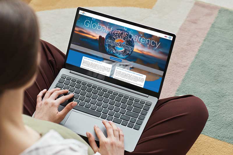 Woman using while labelled app on laptop